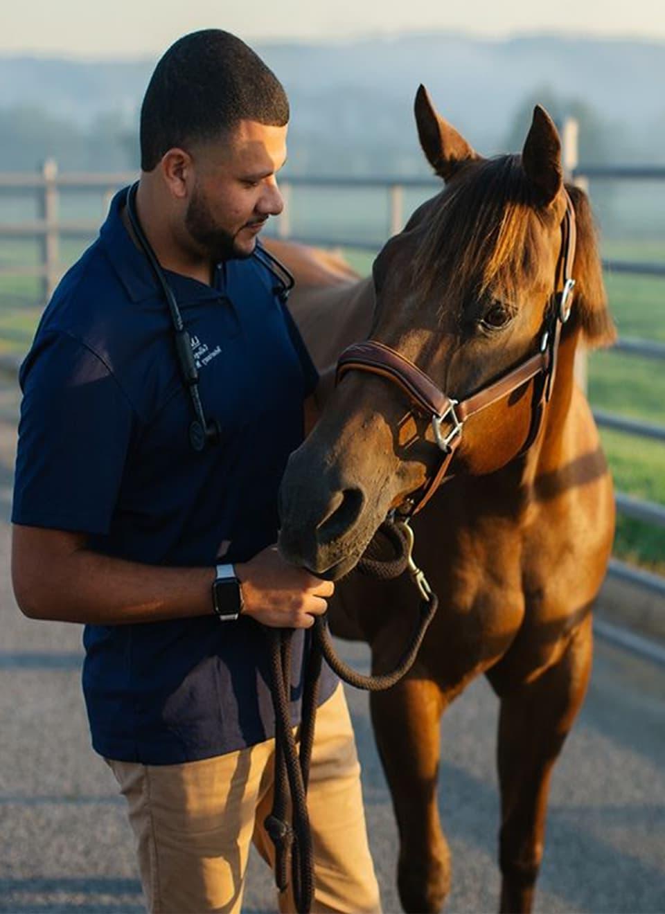 student working with horse